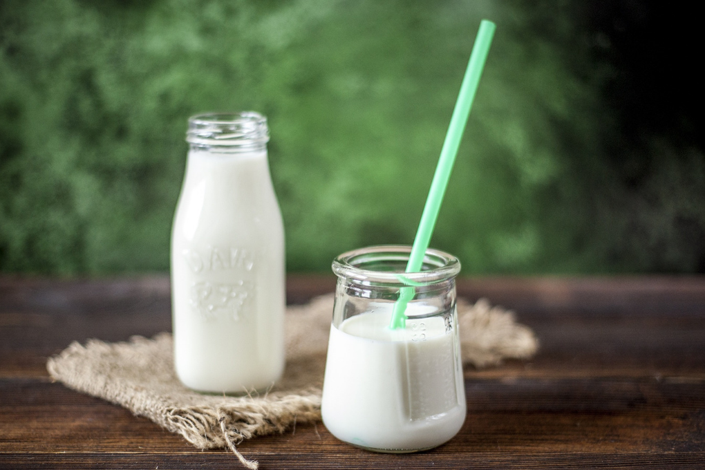 milk in glass with straw