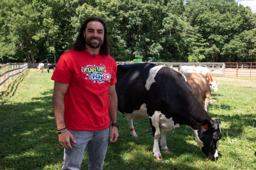 Nate Ebner Player Ambassador at dairy farm with cows